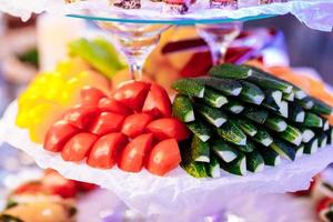 Assorted sliced raw vegetables on plate close up on party. Healthy food. selective focus photo