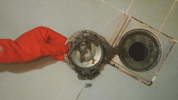 Drain cleaning. Clogged and dirty sewer pipes floor drain. photo