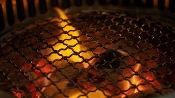 Fire in BBQ Charcoal grill stove for grilling food with smoke hood. video