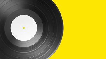 Vinyl record on yellow background with copy space. White label mock up