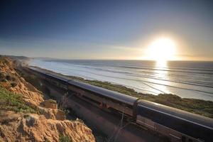 Amtrak trains along the San Diego coastline at dusk photo