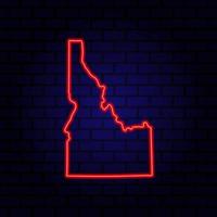 Neon map State of Idaho on brick wall background. vector