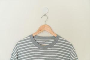 t-shirt hanging with wood hanger photo