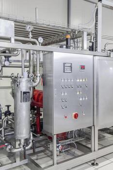 panel with the dashboard in factory  manufacture and bottling of drinks in tin cans. production and bottling of drinks in tin cans photo