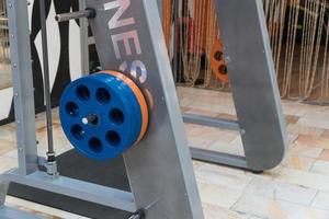 sports equipment and barbells in the gym, closeup photo