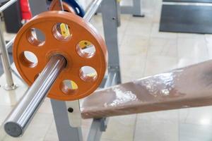 sports equipment and barbells in the gym photo