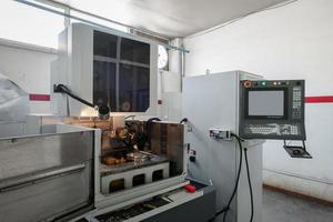 industrial workshop large lathe during the processing photo