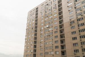 Facade of a modern multi storey residential complex. Urban architecture photo