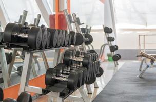 row of dumbbells in a modern gym photo