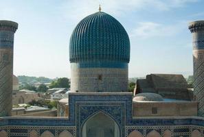 ancient Central Asian building with two columns and a tower. ancient architecture of Central Asia photo