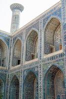 Arch and architecture of the ancient Registan in Samarkand. Ancient architecture of Central Asia photo