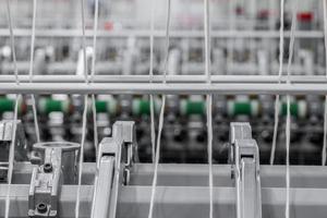 Machinery and equipment in the workshop for the production of thread. Industrial textile factory photo
