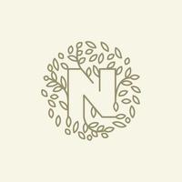 initial N or letter N with leaf  ornament on circle luxury modern logo vector icon illustration design