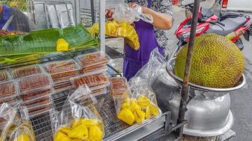 Jackfruit at a street food stand in Bangkok Thailand. photo