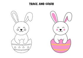 Trace and color cute Easter bunny sitting in eggshell. Worksheet for children.
