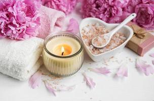 Massage salt and peony flowers photo