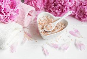 Massage salt and peony flowers photo