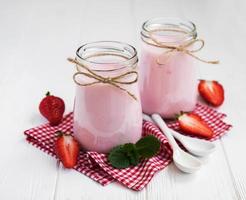 Jars with strawberry yogurt photo