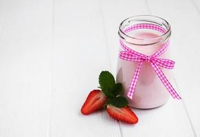 Jar with strawberry yogurt photo