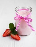 Jar with strawberry yogurt photo