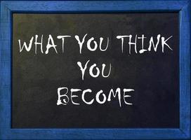 What you think you become. Motivational Quote Phrase on blackboard. photo
