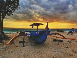 Beautiful morning sun on the beach in Sanur Bali, Indonesia photo