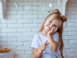 caucasian funny cute little girl baking in kitchen. Bake and culinary concept photo