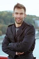 man on the bridge by cityscape background photo