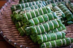 Thai dessert made from bean, and sticky rice ,Wrapped in Banana Leave for eating on chinese new year festival photo