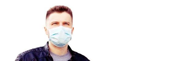 Young man in sterile face mask against corona virus. photo