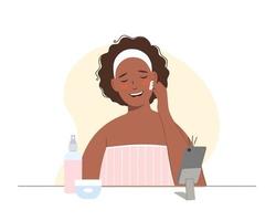 Una bloguera afroamericana de belleza graba una clase magistral para compartirla en las redes sociales. ella pone crema cosmética en su cara. vector