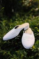 Elegant white wedding shoes photo