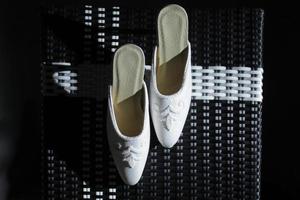 Elegant white wedding shoes photo