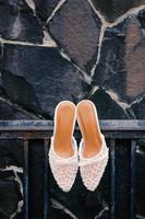 Elegant white wedding shoes photo