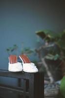 Elegant white wedding shoes photo