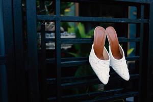 Elegant white wedding shoes photo