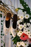 Elegant white wedding shoes photo