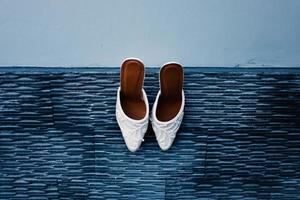 Elegant white wedding shoes photo