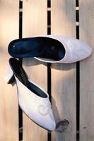 Elegant white wedding shoes photo