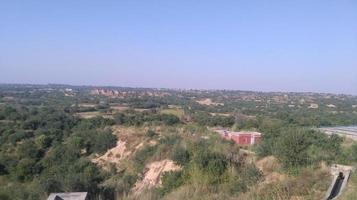 sky view and tree mountains photo