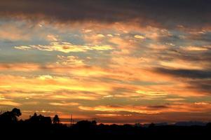Beautiful orange sunset with clouds, nature photo background. Travel, vacation, holiday and relax theme. Gradient color. Sky texture, abstract nature background