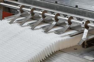 equipment are cut and furrowing the felt fabric for automotive filters photo