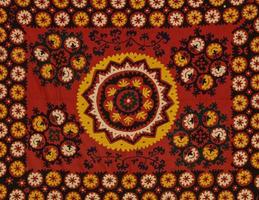 Background from the tissue with oriental ornaments and multi colored pattern, textile photo