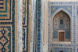 Arch and architecture of the ancient Registan in Samarkand. Ancient architecture of Central Asia photo