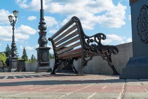 bench on the observation deck against the sky photo