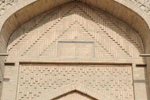 Elements of ancient architecture of Central Asia. Ceiling in the form of a dome in a traditional ancient Asian mosaic photo