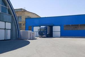 facade of an industrial building and warehouse with freight car photo