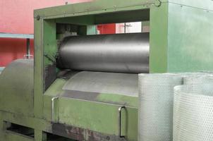 machine for producing metal mesh. machine for twisting a metal mesh in rolls photo