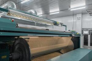 machine evaporates textile yarn. machinery and equipment in a textile factory photo