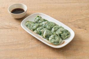 steamed chives dumplings with sauce photo